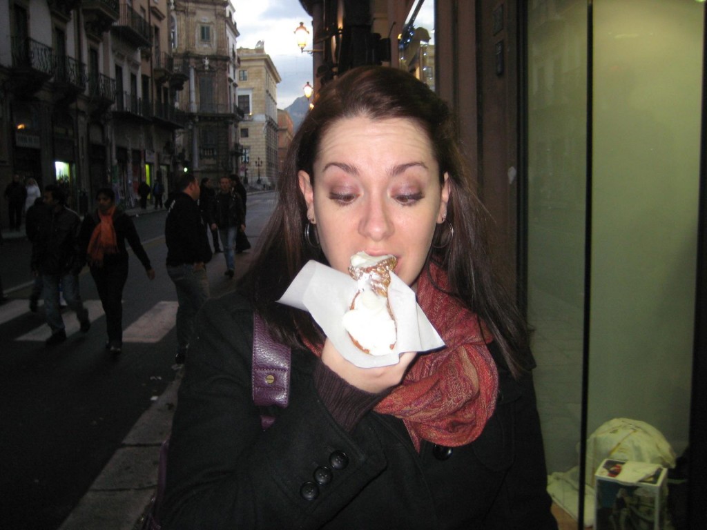 Eating cannoli in Palermo Sicily Italy