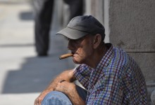 Man Smoking Cigar in Havana Cuba