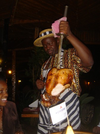 Slicing off a piece of heaven at Carnivore Restaurant in Nairobi Kenya where meats are paraded around on swords for the taking