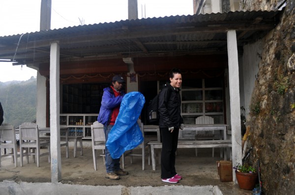 Chandra & Mahesh Stop for Lunch at Mulkharka.  Chandra's coat has been replaced at this point with a giant blue plastic triangle.