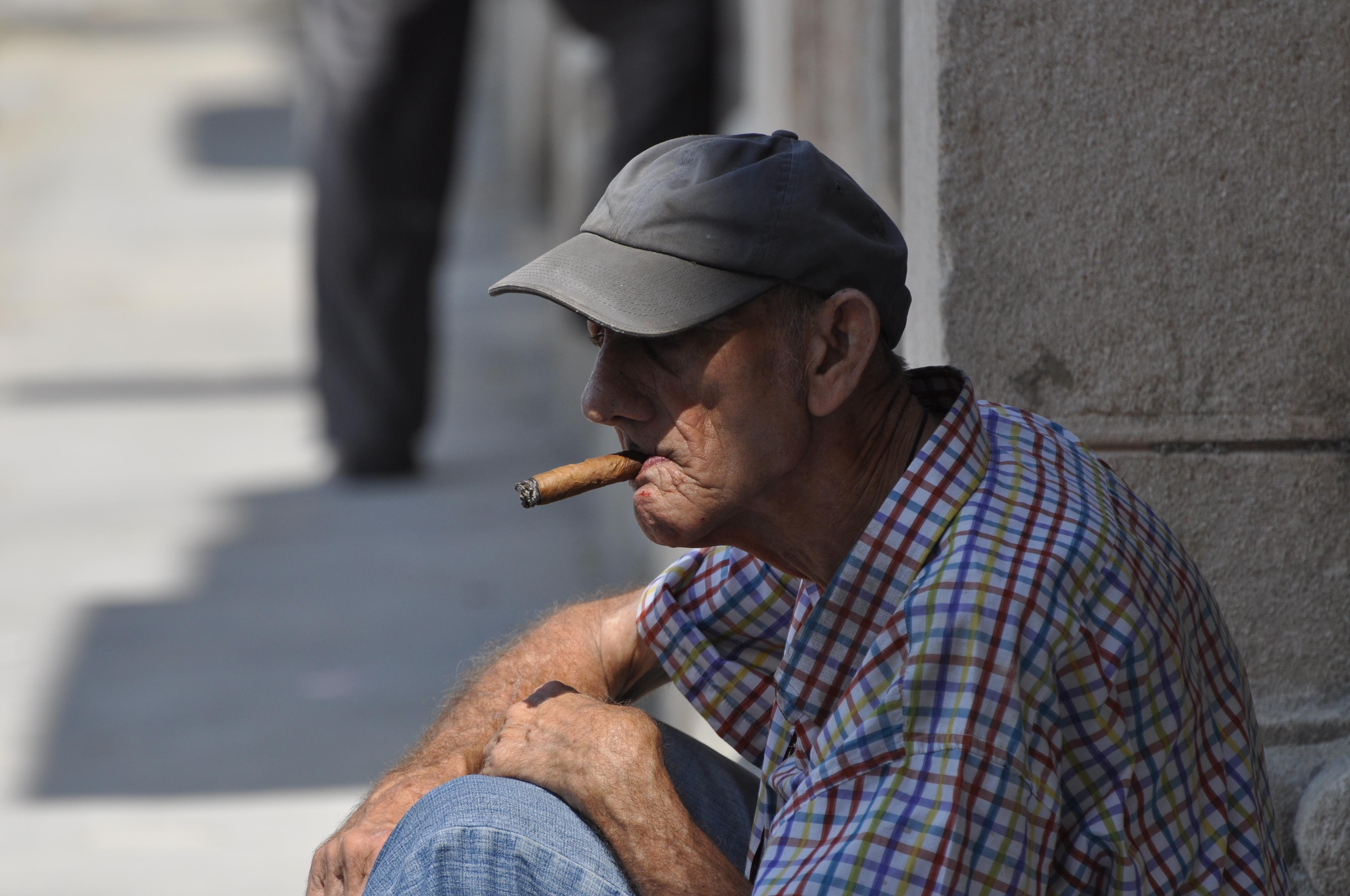 The secret to this man's saggy creased skin and bloody face?  The finest cigars money can buy - Cubans!