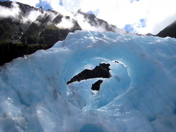 As the glacier moves and flowering water erode away some of the ice, beautiful formations of extremely dense, cold blue ice form.