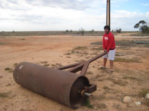 Travis has some fun with abandoned farm equipment in Cook