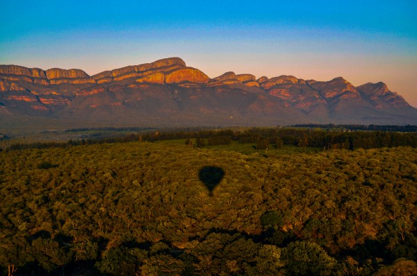 The mountains of Blyde River Canyon and the magical reflection of the hot air balloon.