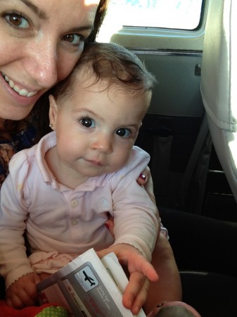 A small plane for a little lady.  Samara consults the flight safety card before takeoff.