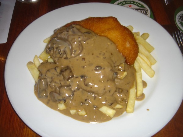 Chicken Schnitzel with Chips and Mushroom Sauce at The Lansdowne in Sydney, Australia