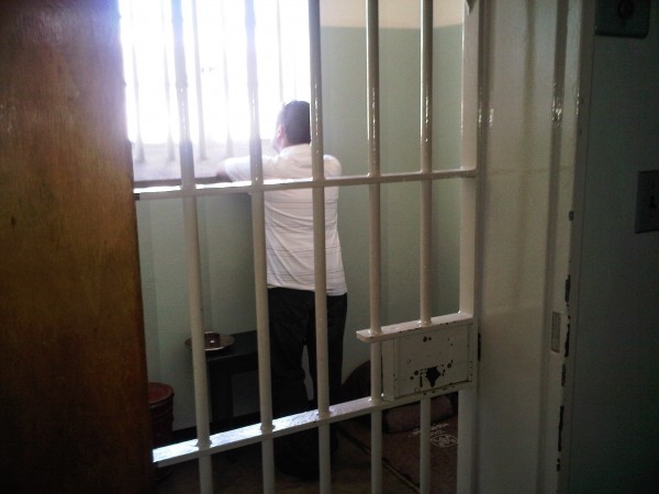 Yours truly contemplating life from inside Nelson Mandela's prison cell