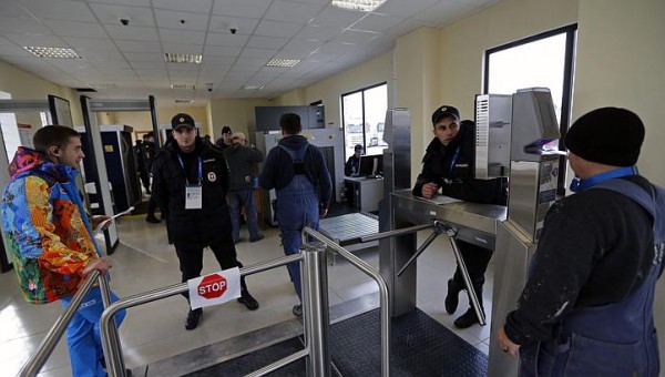 After scanning your credential your image appears on the screen for the guard (right) to verify is really you. Photo copyright The Straits Times.