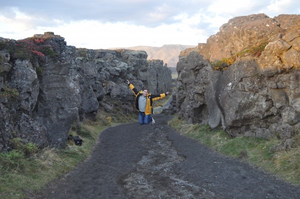 Jumping in between two continents at the Continental Rift outside Reykjavik Iceland