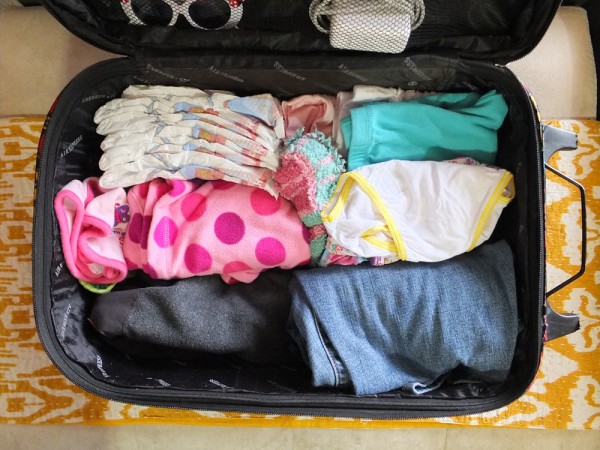 Extra clothes should be in the carry-on, just in case