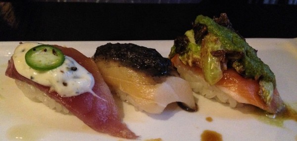 Three courses of Omakase sushi - Yogurt and jalapeno on tuna, balsamic on yellowtail and brussels sprout pesto on salmon