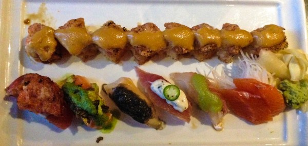 Tuna on crispy rice on top, five pieces of omakase sushi and two beautiful pieces of salmon sashimi on the right