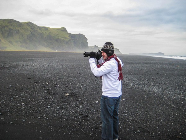 My brother snapping some photos on Vik;s stunning black sand beach.