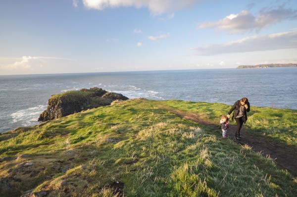 Chandra walking with our daughter on Carrickarede  Island.