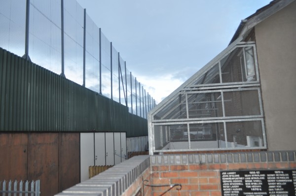 Fenced Homes Against Peace Wall in Belfast