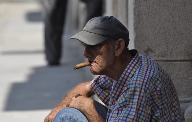 The secret to this man's saggy creased skin and bloody face?  The finest cigars money can buy - Cubans!