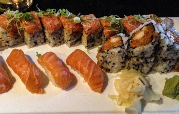 Traditional PRO in the back, four pieces of salmon nigiri and a spicy scallop crunch roll