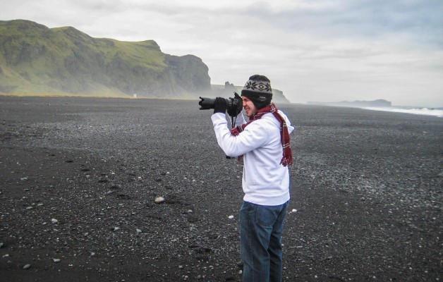My brother snapping some photos on Vik;s stunning black sand beach.