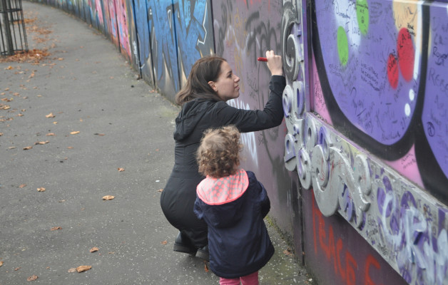 Chandra Signs Peace Wall with Samara